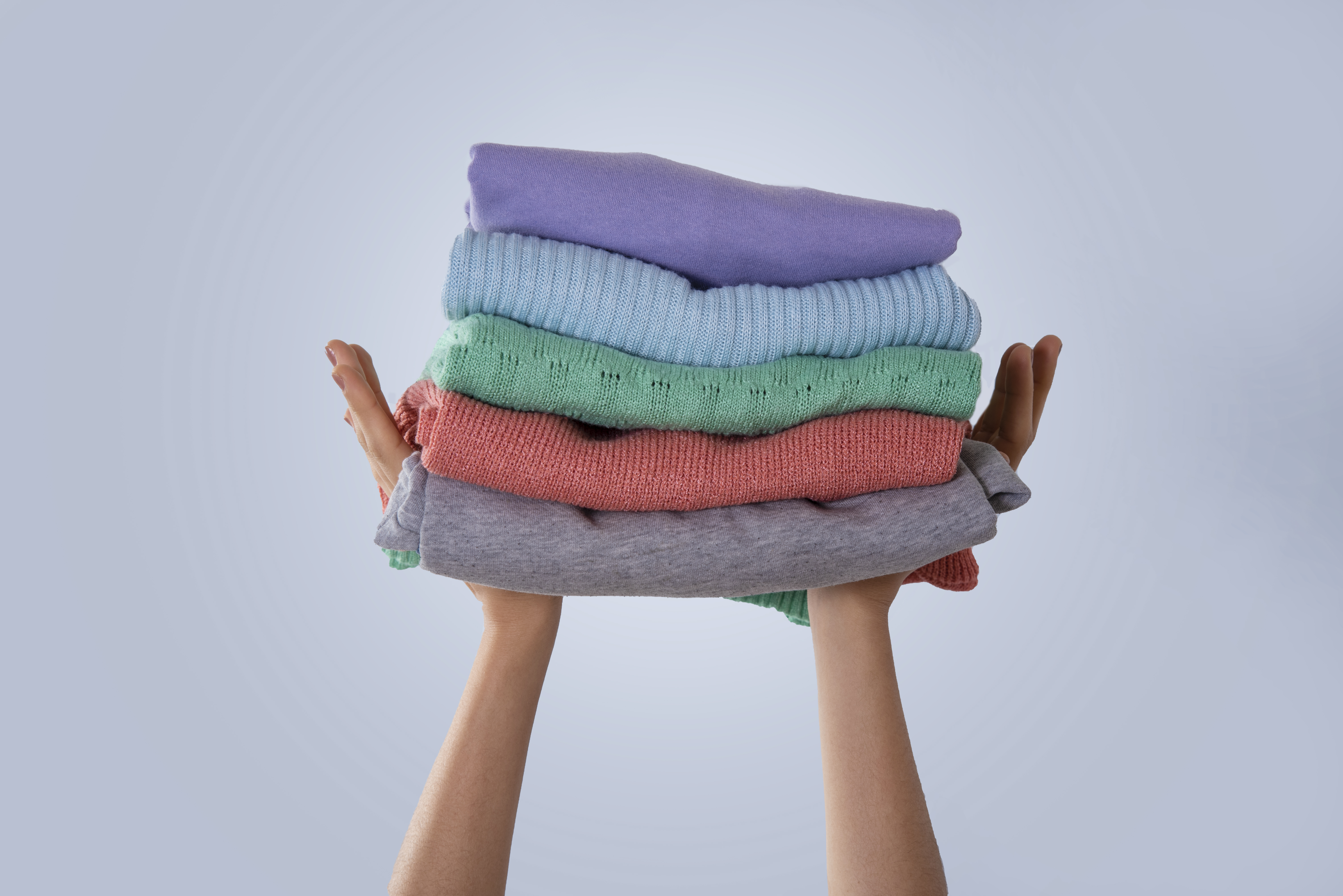 Freshly cleaned, neatly folded colourful clothes